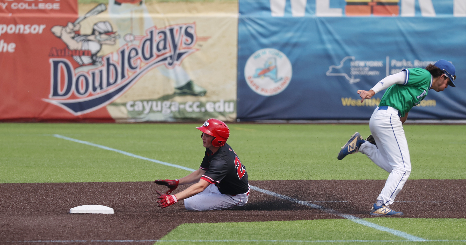 Tyler Ziemak slides into second in Cayuga's loss to Finger Lakes CC on Sunday.