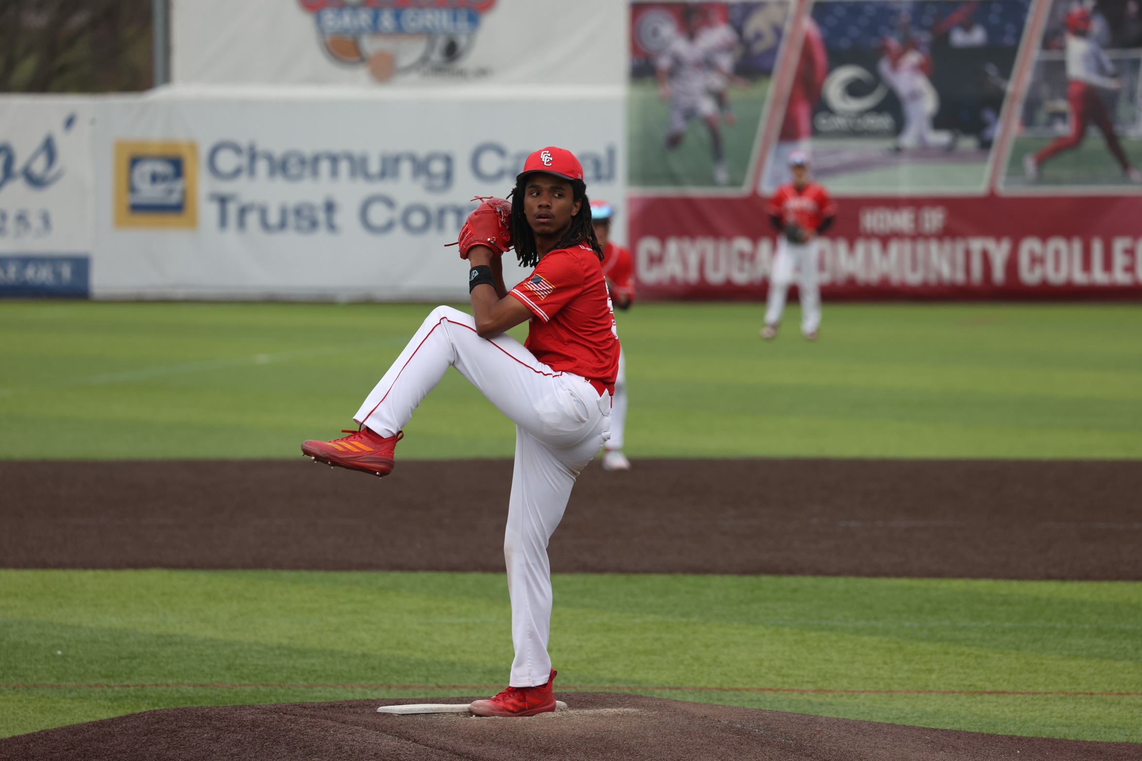 A Cayuga baseball player throws a pitch.