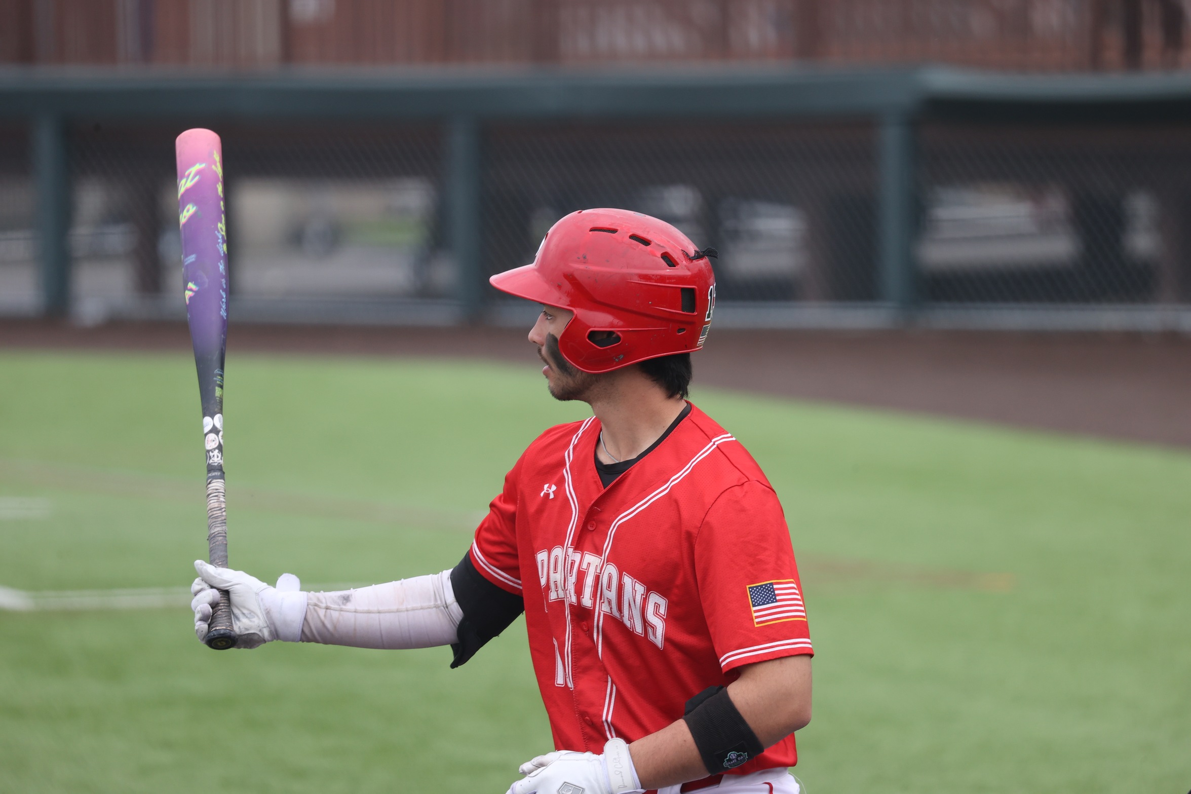 A Cayuga player waits to swing at a pitch.