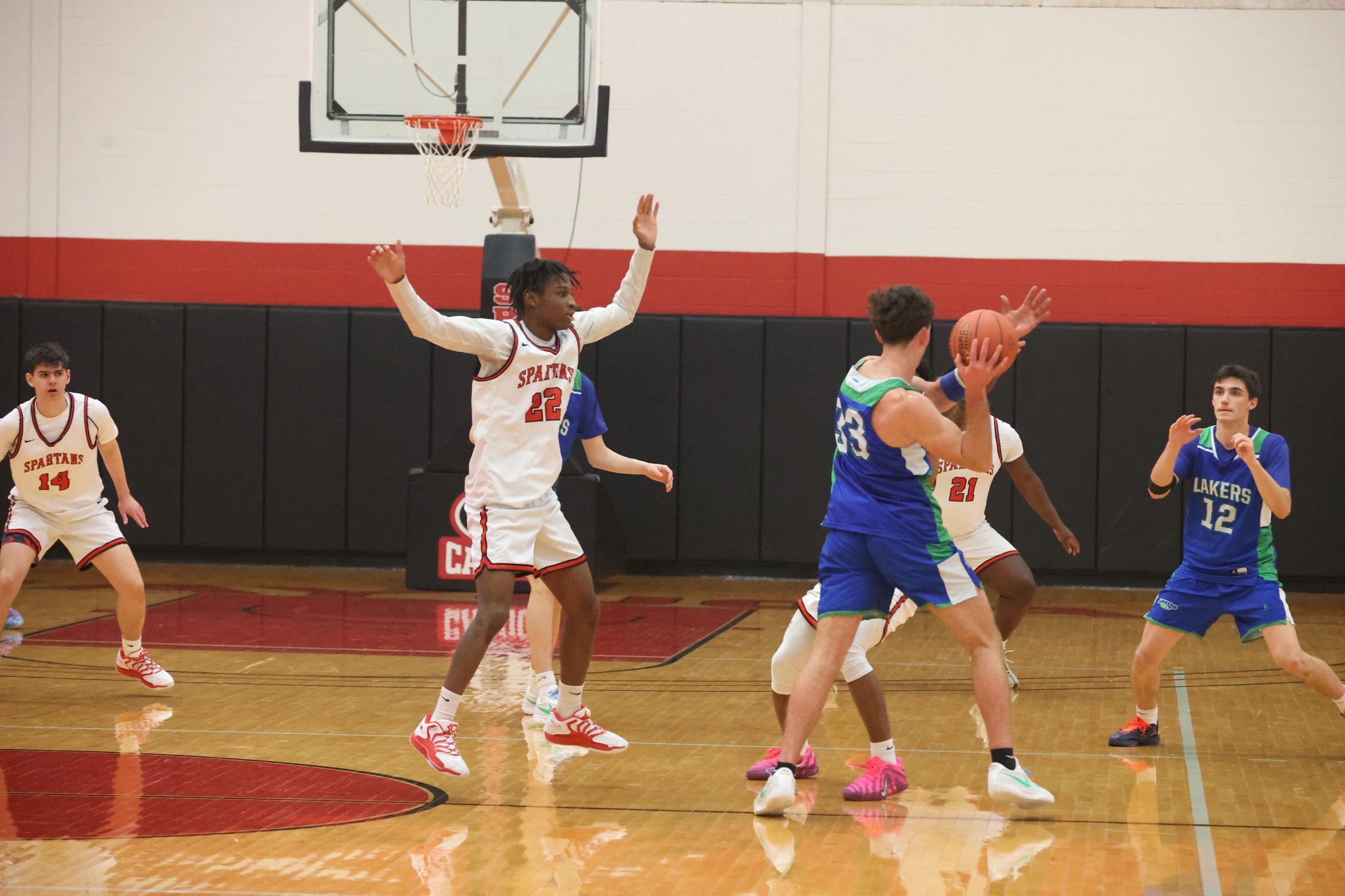 Cayuga players defend against a Finger Lakes Community College player trying to pass.