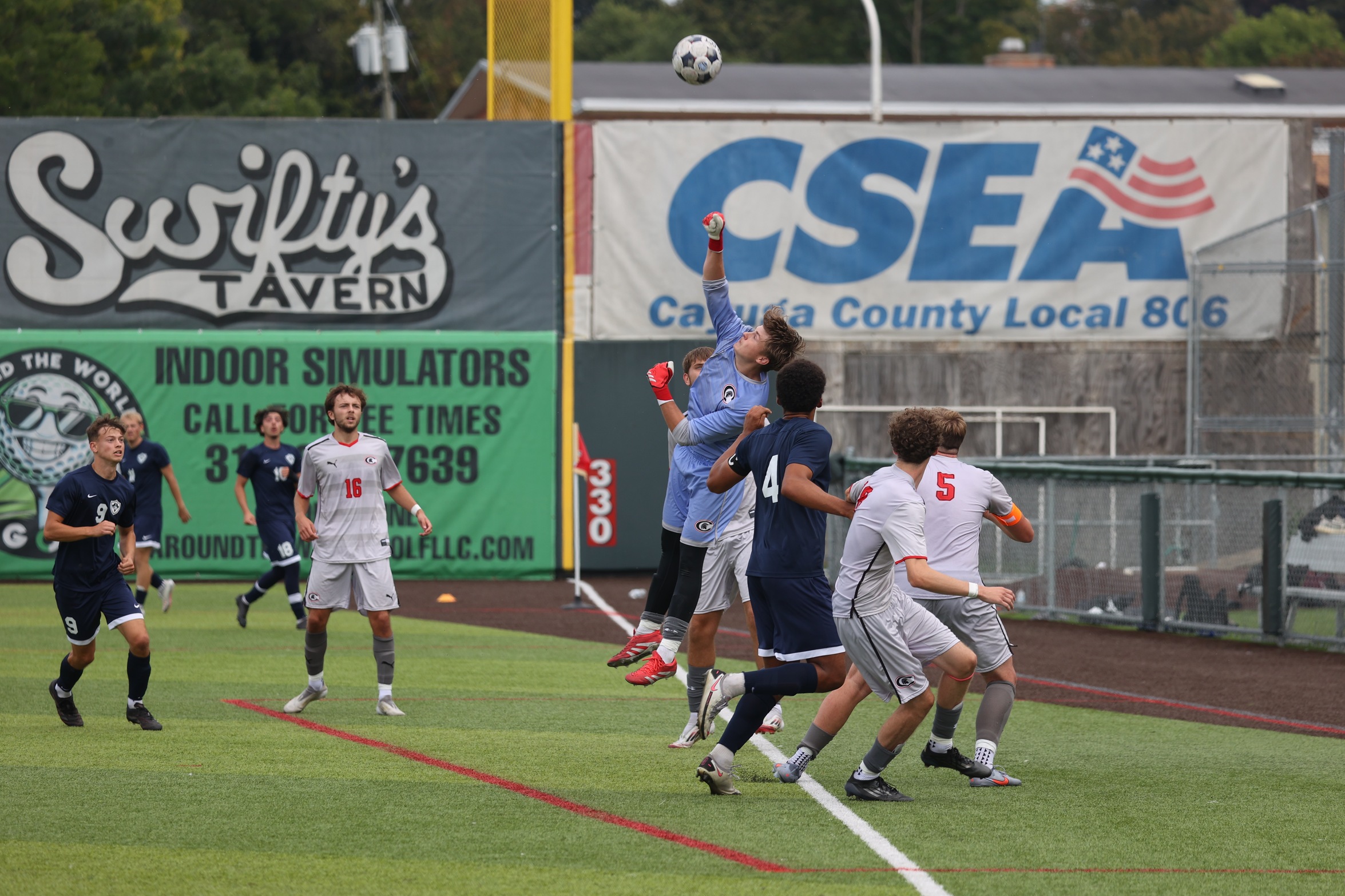 Matthew Chitty blocks a shot by Fulton-Montgomery Community College in a 2-1 Spartans win on Saturday.