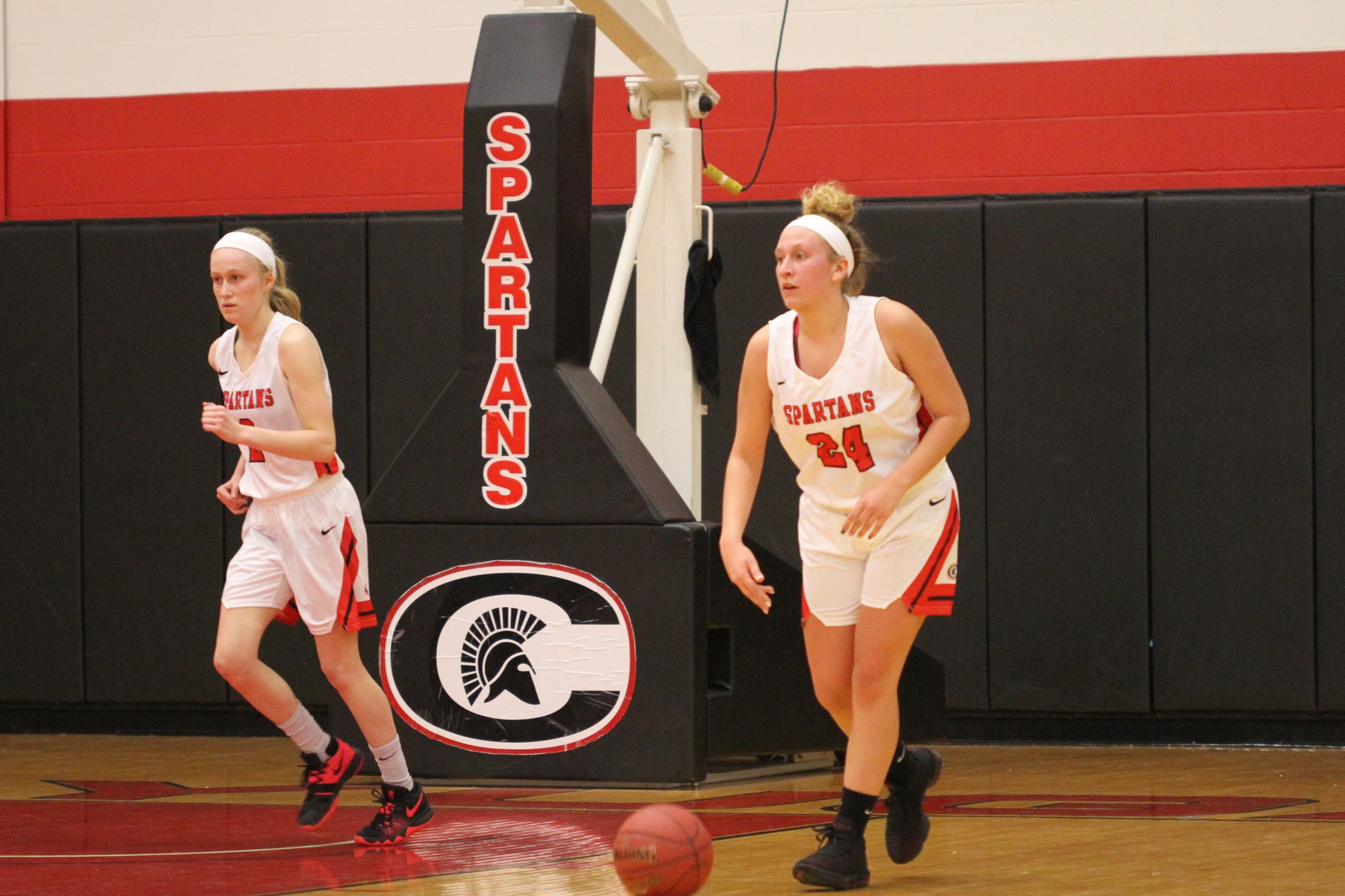 Cayuga's Hanna Keyser (24) and Erica Helzer bring the ball up the court against Jefferson Community College. Keyser and Helzer led the team in scoring against the Cannoneers.